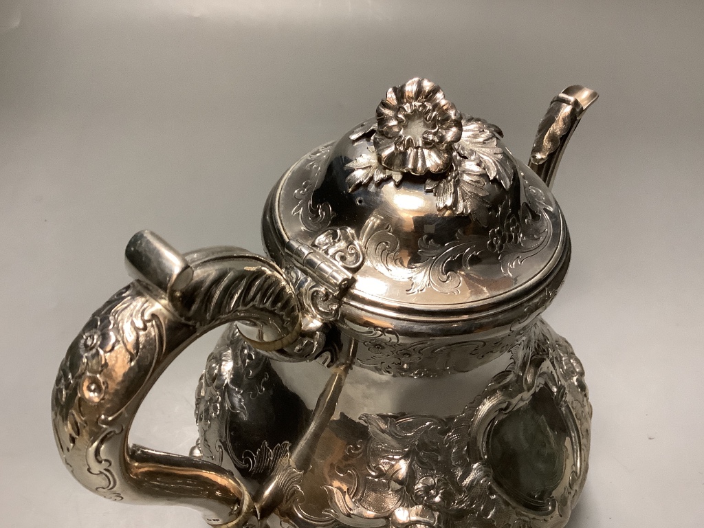 A Victorian embossed silver coffee pot, by George Ivory, London 1857 height 18.2 cm